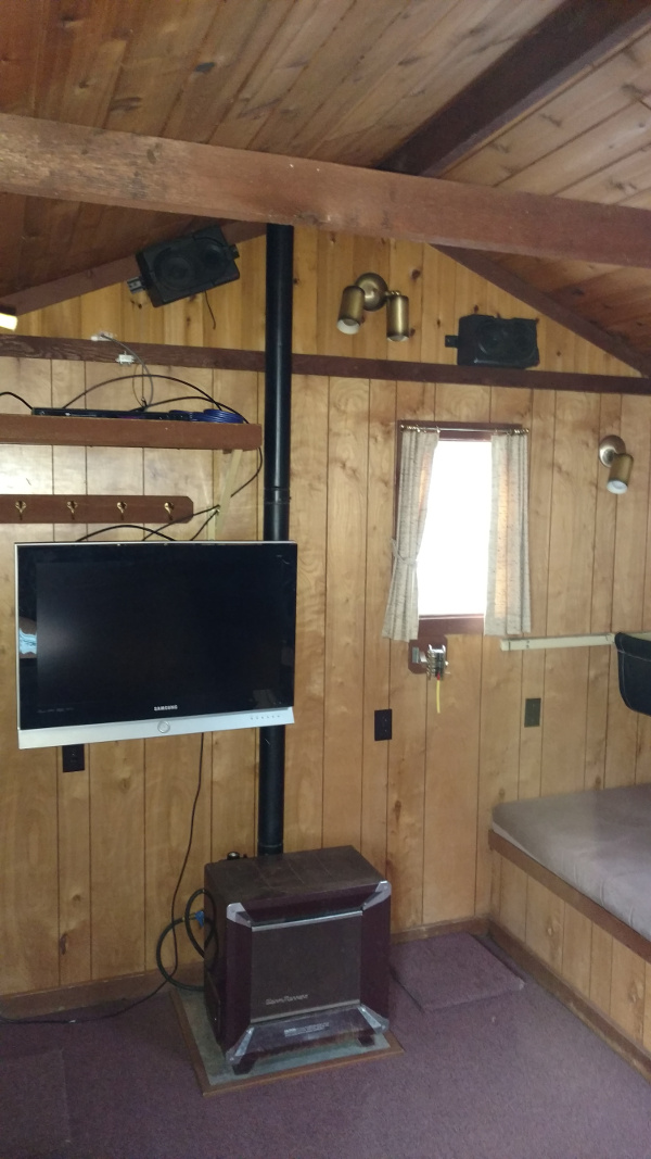 10x20 Ice Fishing House Showing Bunk, Stove and TV